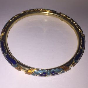 Gold bangle bracelet with enamel butterfly design